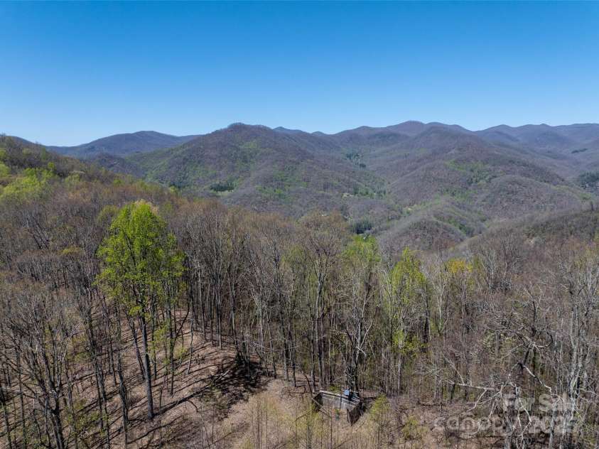 318 Brown Mountain Drive, Cullowhee, NC 28723.  MLS# CAR4235887, YatesRealty ID 8200. Two of two Horse Sheds on the property. This one is at the top of the mountain. The roof has blown off and the pasture has been overgrown with tulip poplar saplings