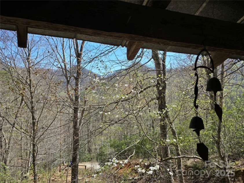 318 Brown Mountain Drive, Cullowhee, NC 28723.  MLS# CAR4235887, YatesRealty ID 8200. View from covered porch (needs clearing)