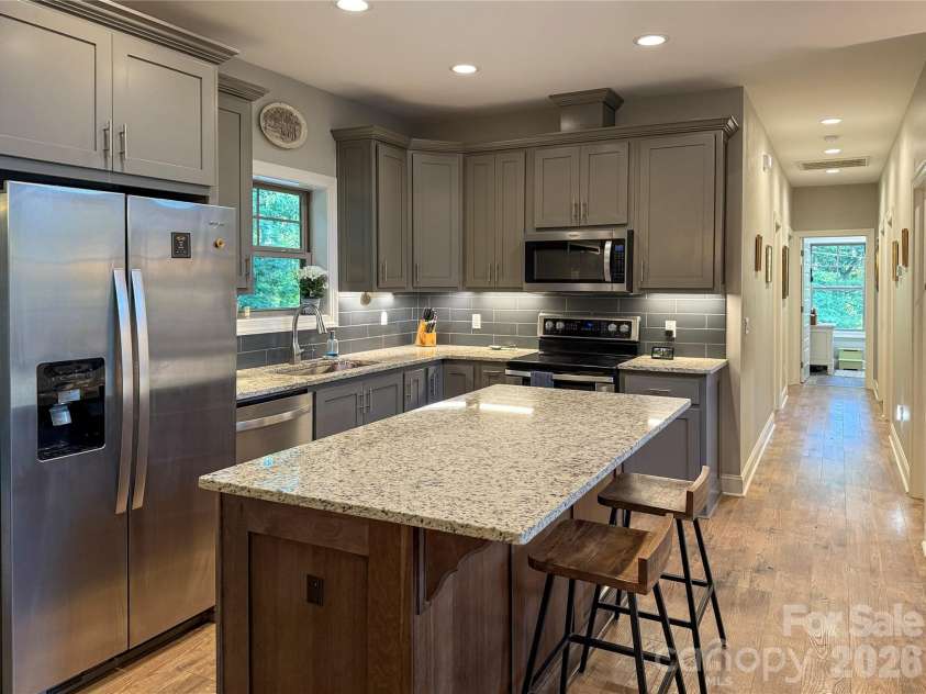 297 Paradise Point, Lake Lure, NC 28746.  MLS# CAR4361894, YatesRealty ID 8212. Bright chef’s kitchen with new appliances and ample entertaining space. 