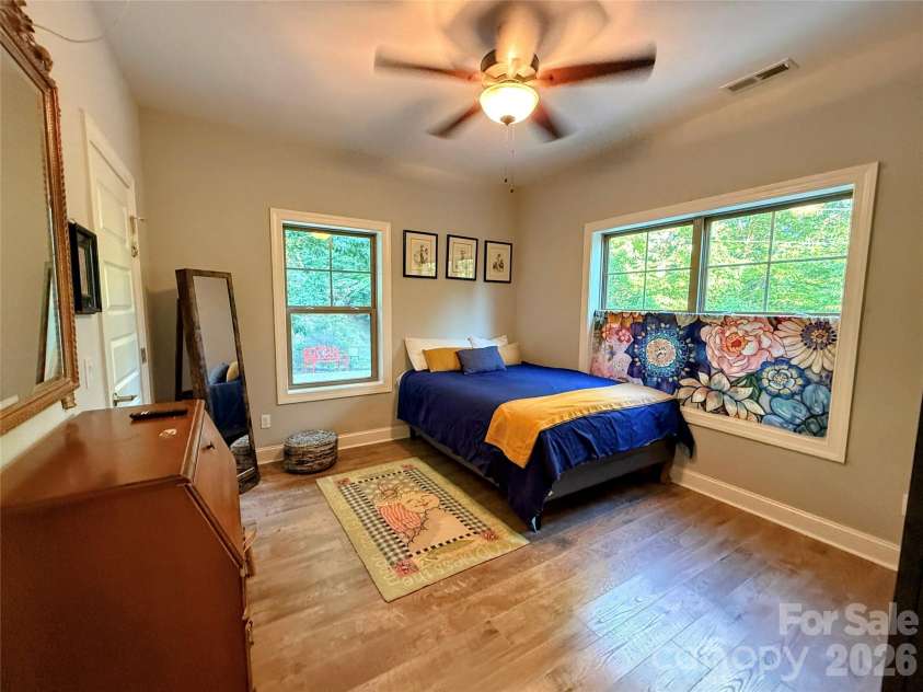 297 Paradise Point, Lake Lure, NC 28746.  MLS# CAR4361894, YatesRealty ID 8212. Restful sunny second bedroom 