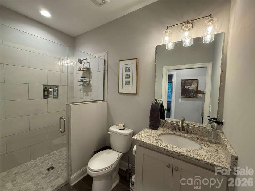 297 Paradise Point, Lake Lure, NC 28746.  MLS# CAR4361894, YatesRealty ID 8212. Sleek and easy hall bath