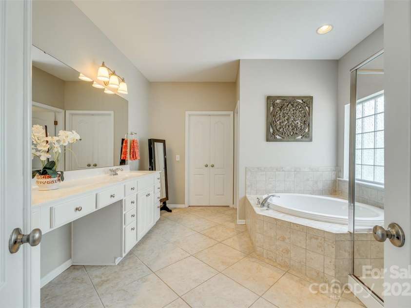 349 Miners Cove Way, Fort Mill, SC 29708.  MLS# CAR4248883, YatesRealty ID 8213. The bathroom's dimensions allow for ample room to move freely, eliminating the cramped feeling often found in smaller bathrooms.