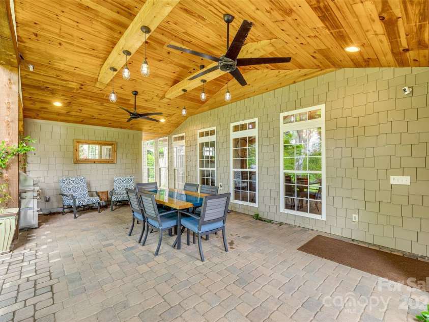 349 Miners Cove Way, Fort Mill, SC 29708.  MLS# CAR4248883, YatesRealty ID 8213. This property boasts a valuable addition to its backyard: a dedicated outdoor garden and storage area.