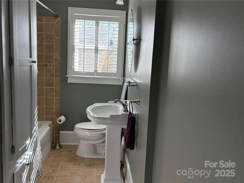 114 Broadway Avenue, Tryon, NC 28782.  MLS# CAR4322856, YatesRealty ID 823. Main floor full bath has been restored with quality fixtures and finishes.