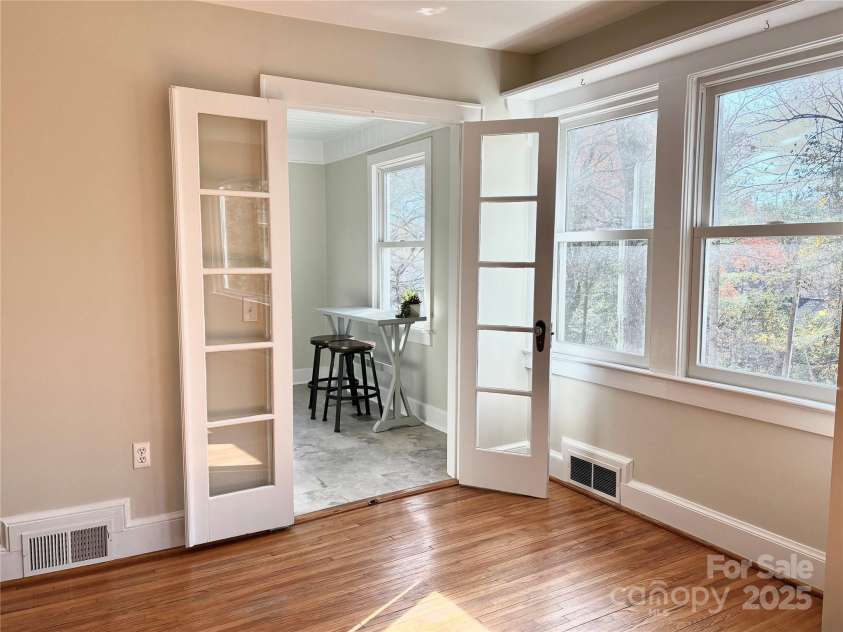 114 Broadway Avenue, Tryon, NC 28782.  MLS# CAR4322856, YatesRealty ID 823. Office area on the main level is filled with light and would be a great spot for the washer and dryer if you wanted them on the main level.