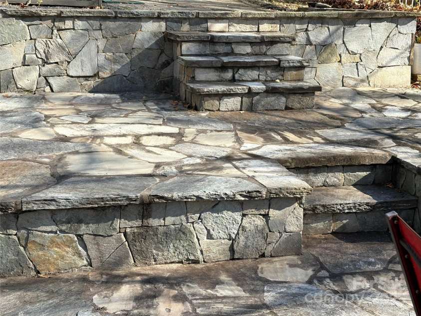 114 Broadway Avenue, Tryon, NC 28782.  MLS# CAR4322856, YatesRealty ID 823. This house has amazing stone updates - lots of outdoor entertaining space!