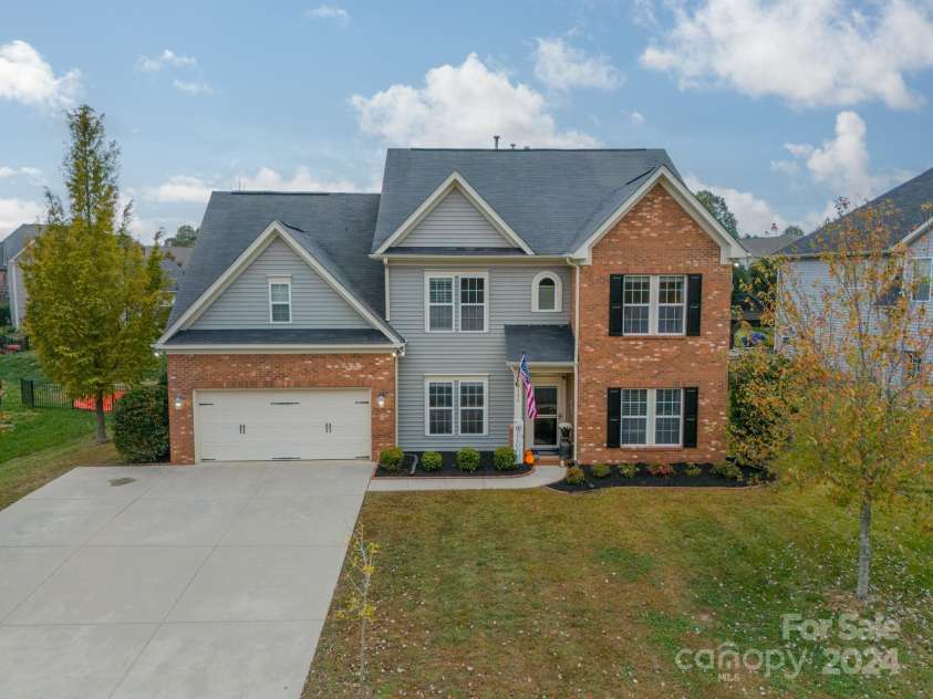10126 Loch Lomond Drive, Charlotte, NC 28278.  MLS# CAR4200492, YatesRealty ID 824. Updated black shutters, front door and mulch
