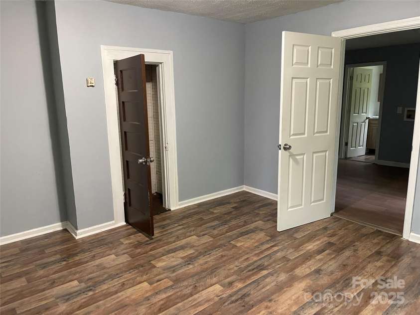 215 Mahan Street, Concord, NC 28025.  MLS# CAR4250870, YatesRealty ID 8242. Bedroom on right side