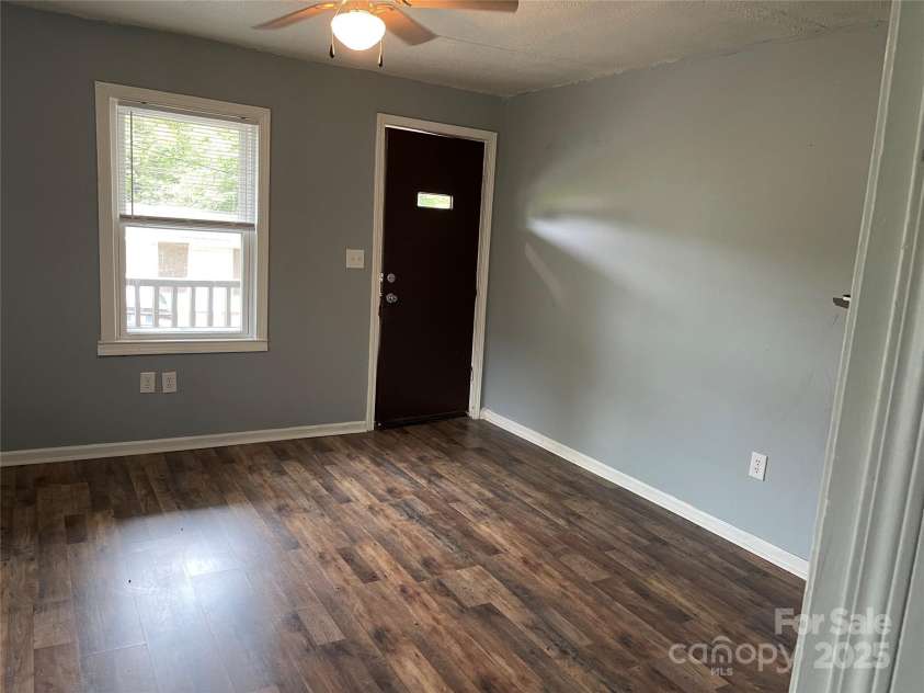 215 Mahan Street, Concord, NC 28025.  MLS# CAR4250870, YatesRealty ID 8242. Entry to home in Family room on right side