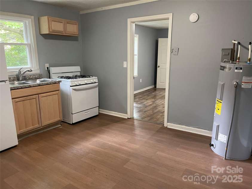 215 Mahan Street, Concord, NC 28025.  MLS# CAR4250870, YatesRealty ID 8242. Kitchen on Right side