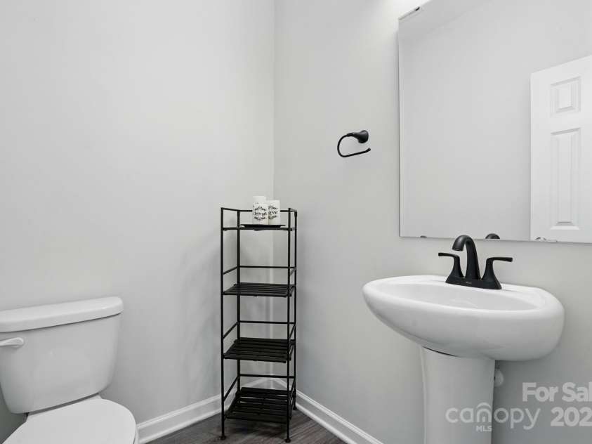 11040 Lake Road, Charlotte, NC 28215.  MLS# CAR4244605, YatesRealty ID 8243. Downstairs half bath.