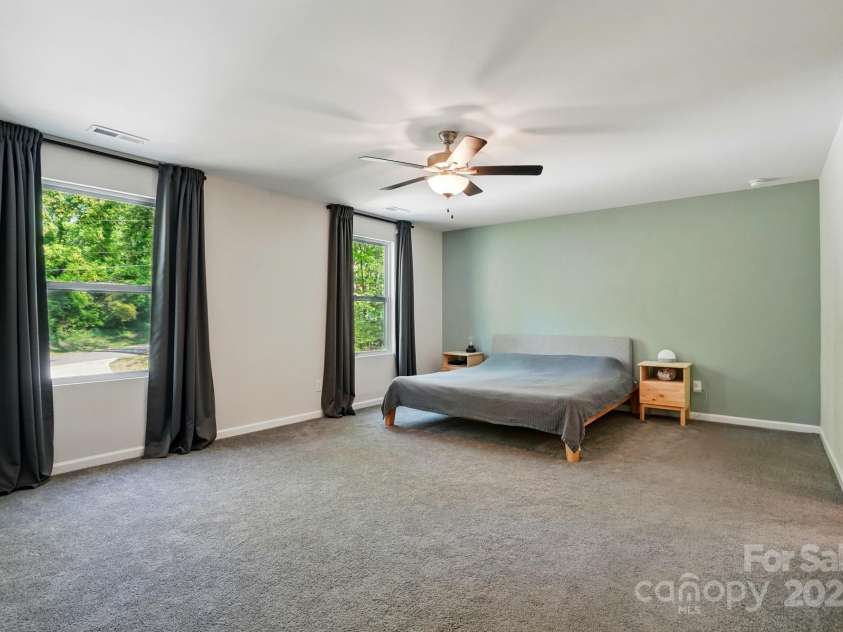 11040 Lake Road, Charlotte, NC 28215.  MLS# CAR4244605, YatesRealty ID 8243. Huge primary bedroom with an ensuite bathroom.
