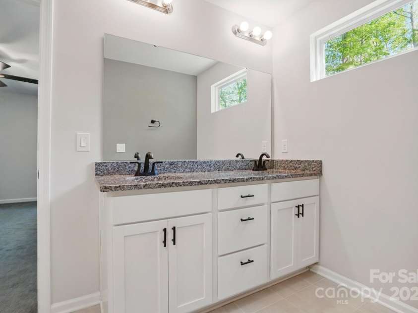 11040 Lake Road, Charlotte, NC 28215.  MLS# CAR4244605, YatesRealty ID 8243. Primary bath with his and hers sinks