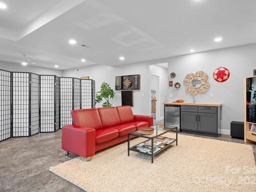 940 Hawk Ridge Drive, Mill Spring, NC 28756.  MLS# CAR4227450, YatesRealty ID 8244. Lower level/basement finished space with tons of options for entertainment, gym, office space etc.