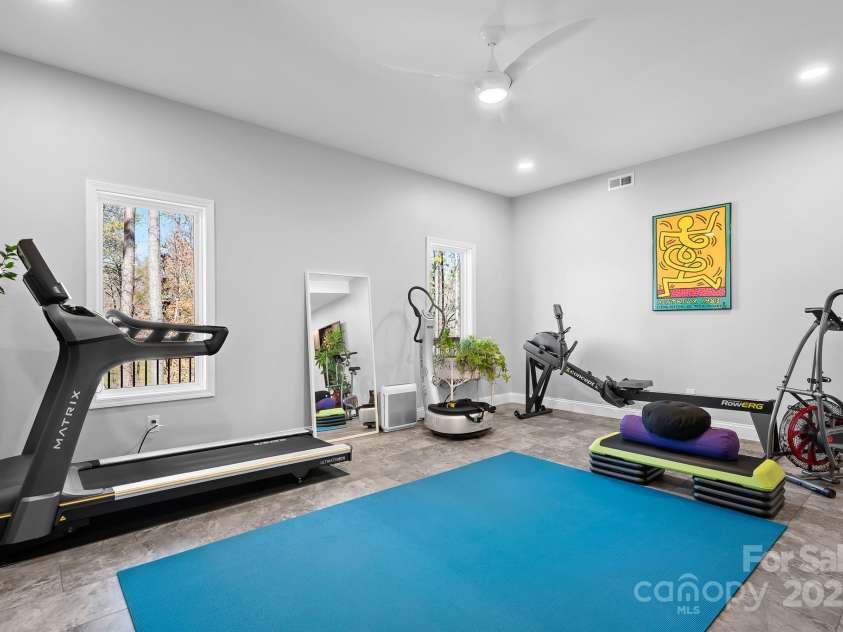 940 Hawk Ridge Drive, Mill Spring, NC 28756.  MLS# CAR4227450, YatesRealty ID 8244. Lower level/basement finished space with tons of options for entertainment, gym, office space etc.