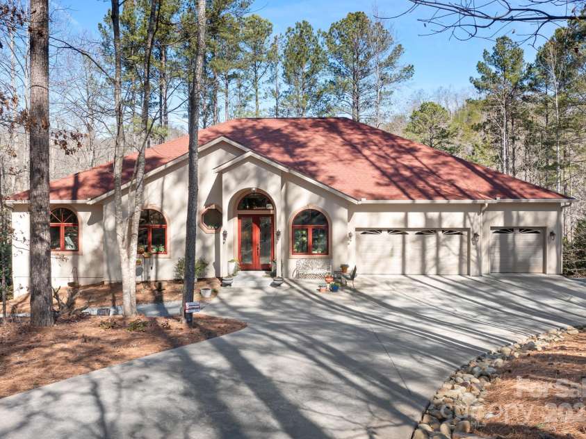940 Hawk Ridge Drive, Mill Spring, NC 28756.  MLS# CAR4227450, YatesRealty ID 8244. Modern home tucked away in the Boating and Equestrian Community of Lake Adger.