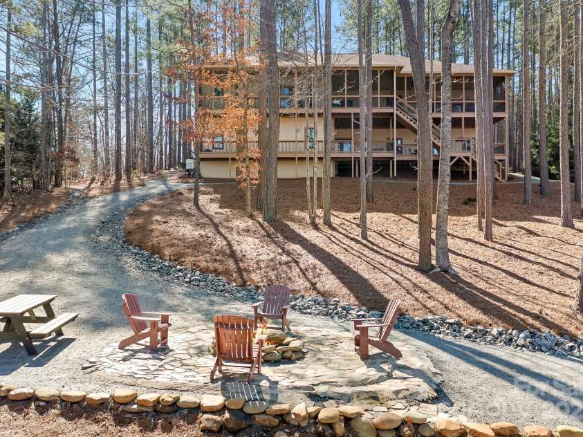 940 Hawk Ridge Drive, Mill Spring, NC 28756.  MLS# CAR4227450, YatesRealty ID 8244. Stunning Waterfront Luxury Home on Lake Adger with sweeping views of the lake and Floating Dock