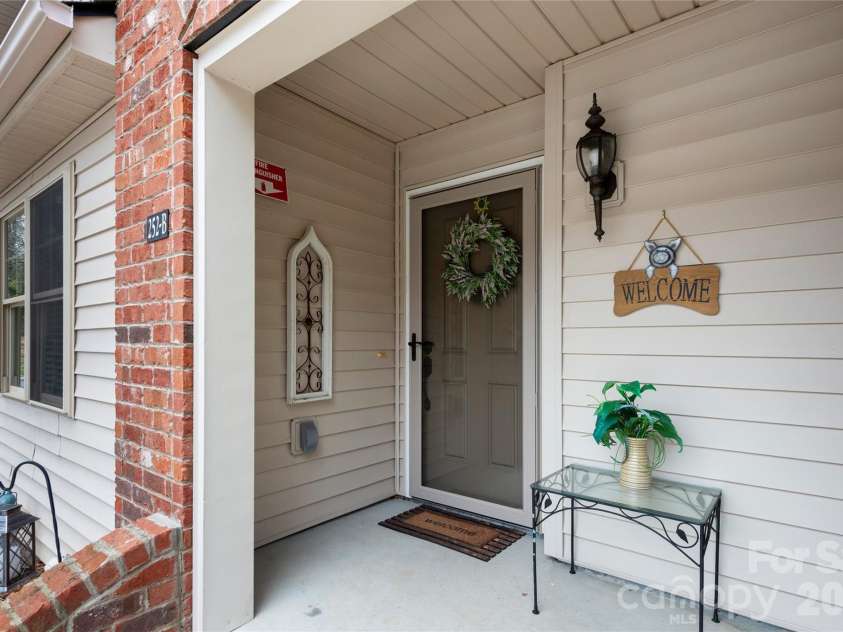252 Wash Creek Drive, Hendersonville, NC 28739.  MLS# CAR4334994, YatesRealty ID 825. Charming Covered Entrance 