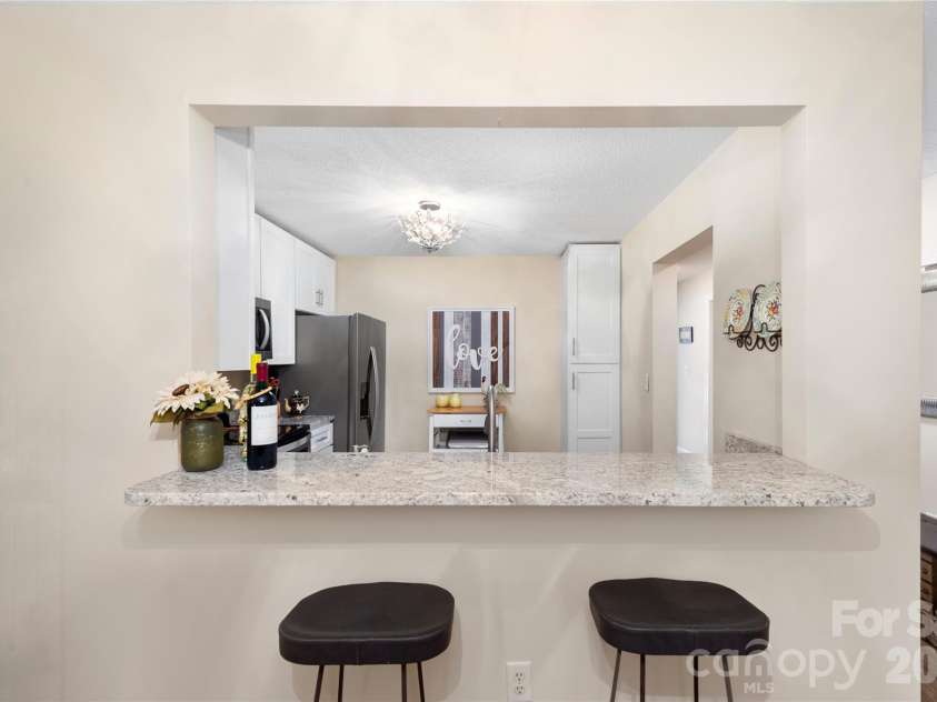 252 Wash Creek Drive, Hendersonville, NC 28739.  MLS# CAR4334994, YatesRealty ID 825. Dine at The Kitchen Bar 