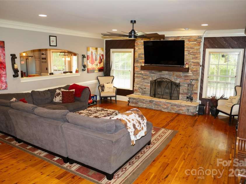 105 Eubanks Road, Monroe, NC 28112.  MLS# CAR4309646, YatesRealty ID 8250. Great Room with wood burning fireplace