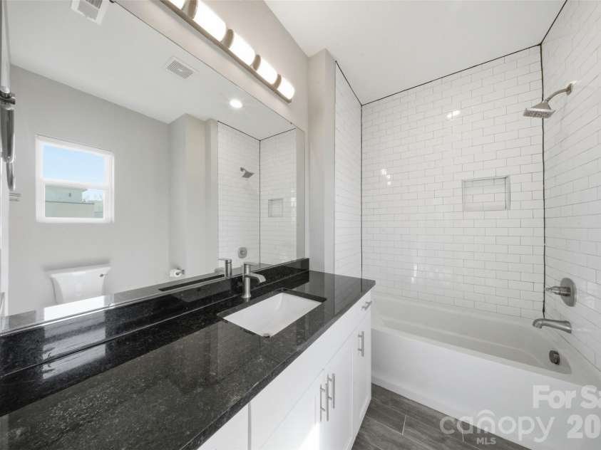 1602 Julia Maulden Place, Charlotte, NC 28206.  MLS# CAR4356693, YatesRealty ID 8256. Ensuite bathroom to hte second bedroom third floor