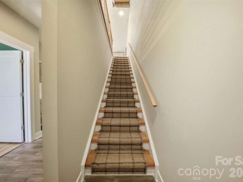 1602 Julia Maulden Place, Charlotte, NC 28206.  MLS# CAR4356693, YatesRealty ID 8256. Stairs up to main level