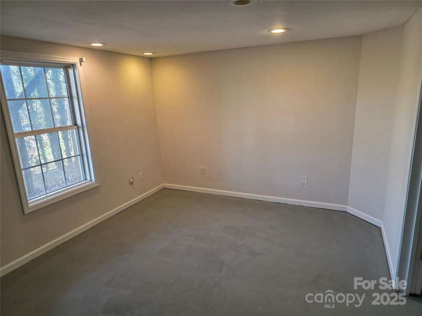 12 White Squirrel Lane, Hendersonville, NC 28739.  MLS# CAR4328399, YatesRealty ID 8261. Basement Room w/closet