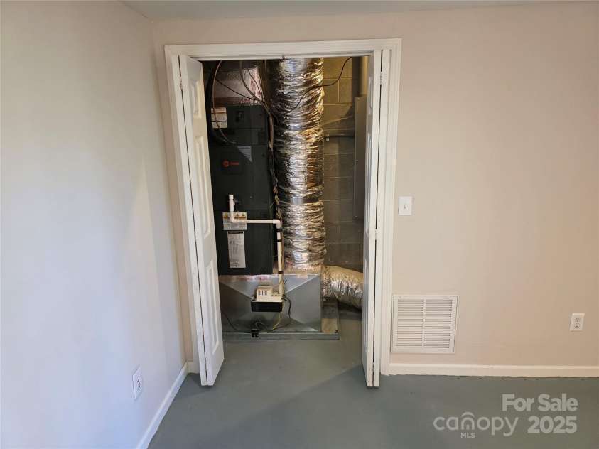 12 White Squirrel Lane, Hendersonville, NC 28739.  MLS# CAR4328399, YatesRealty ID 8261. Mechanical Closet HVAC