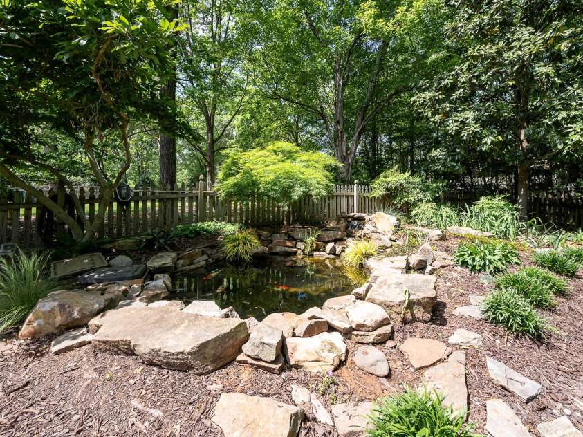 5206 Morrowick Road, Charlotte, NC 28226.  MLS# CAR4249566, YatesRealty ID 8266. Koi pond