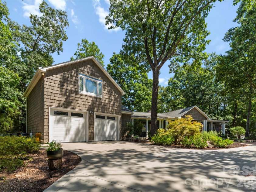 16318 Belle Isle Drive, Cornelius, NC 28031.  MLS# CAR4292940, YatesRealty ID 8272. 2 car oversized garage with bonus living quarters flex space.