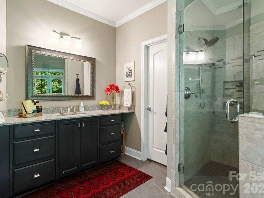 16318 Belle Isle Drive, Cornelius, NC 28031.  MLS# CAR4292940, YatesRealty ID 8272. Ensuite Primary bath with walk in shower