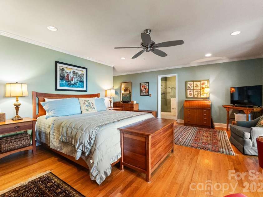 16318 Belle Isle Drive, Cornelius, NC 28031.  MLS# CAR4292940, YatesRealty ID 8272. Primary bedroom with wall to wall bookcase 