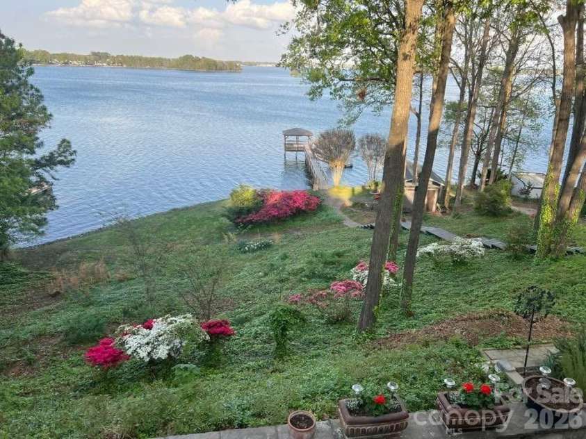 16318 Belle Isle Drive, Cornelius, NC 28031.  MLS# CAR4292940, YatesRealty ID 8272. Spring Views without the tree canopy