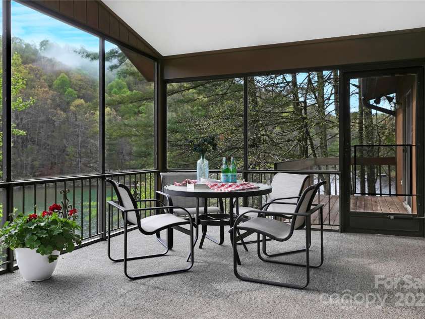 228 Echota Lane, Brevard, NC 28712.  MLS# CAR4249014, YatesRealty ID 8276. Enjoy morning coffee and evening cocktails from your screen porch