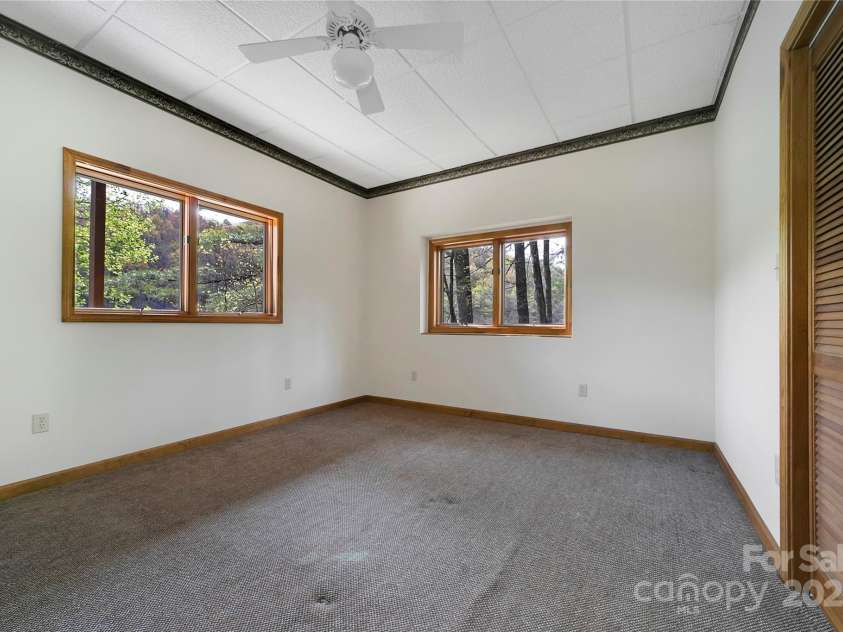228 Echota Lane, Brevard, NC 28712.  MLS# CAR4249014, YatesRealty ID 8276. Lower level bedroom