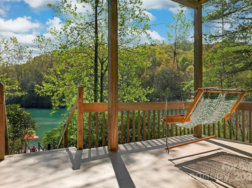 228 Echota Lane, Brevard, NC 28712.  MLS# CAR4249014, YatesRealty ID 8276. Lower level deck