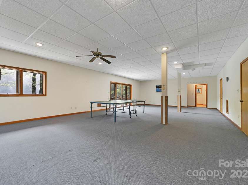 228 Echota Lane, Brevard, NC 28712.  MLS# CAR4249014, YatesRealty ID 8276. Lower level Family Room
