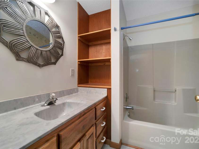 228 Echota Lane, Brevard, NC 28712.  MLS# CAR4249014, YatesRealty ID 8276. Main level bathroom