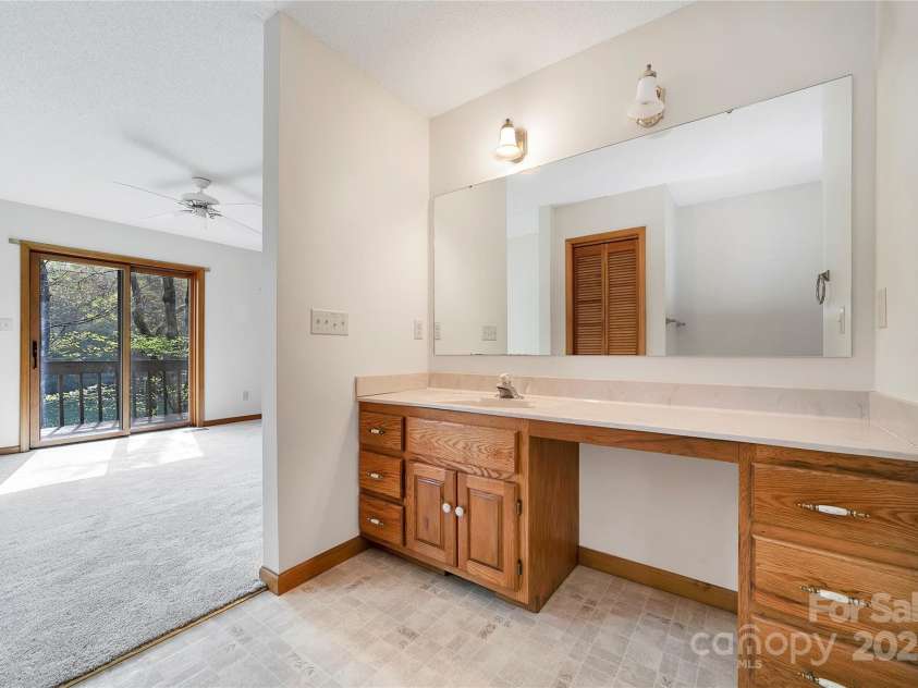 228 Echota Lane, Brevard, NC 28712.  MLS# CAR4249014, YatesRealty ID 8276. Primary spacious bathroom
