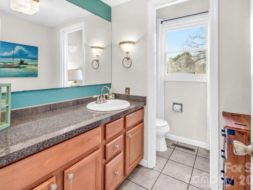 8550 Cottonwood Trail, Concord, NC 28027.  MLS# CAR4342361, YatesRealty ID 8295. Downstairs bathroom