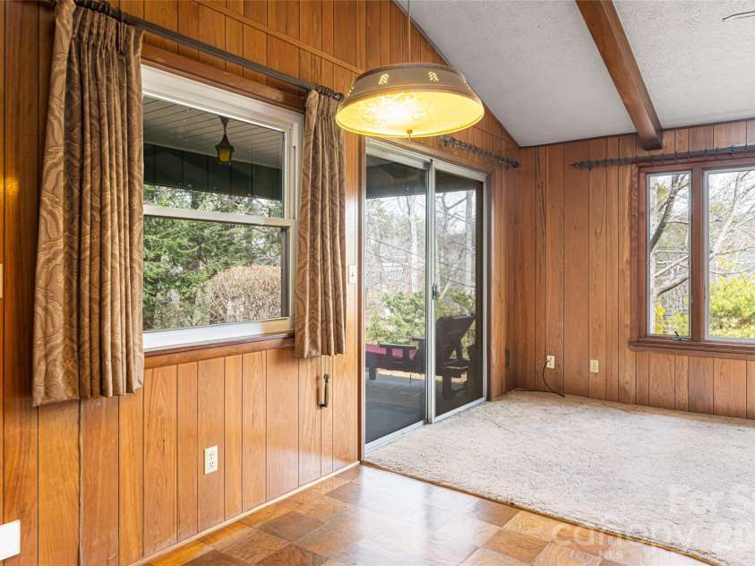 180 Lakewood Drive, Asheville, NC 28803.  MLS# CAR4341073, YatesRealty ID 8297. 2 Bedroom Apt |  Living Room to Covered Porch