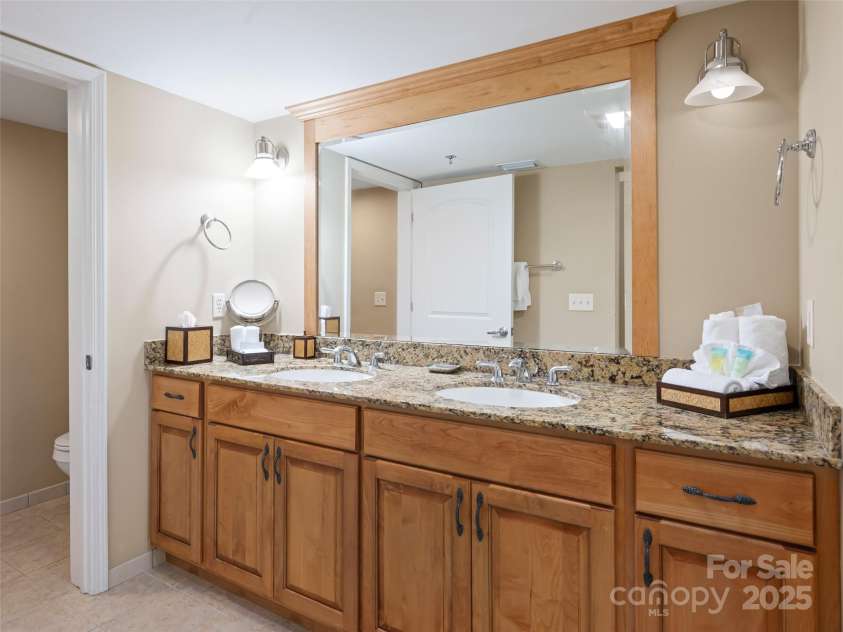 118 Bowling Park Road, Asheville, NC 28803.  MLS# CAR4128306, YatesRealty ID 83. Primary bath with double vanity