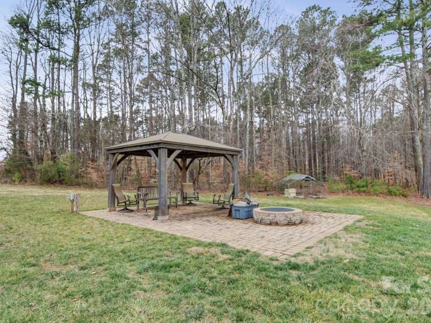 1296 Ben Black Road, Midland, NC 28107.  MLS# CAR4349291, YatesRealty ID 8300. Gazebo and fire pit overlooking the pond!