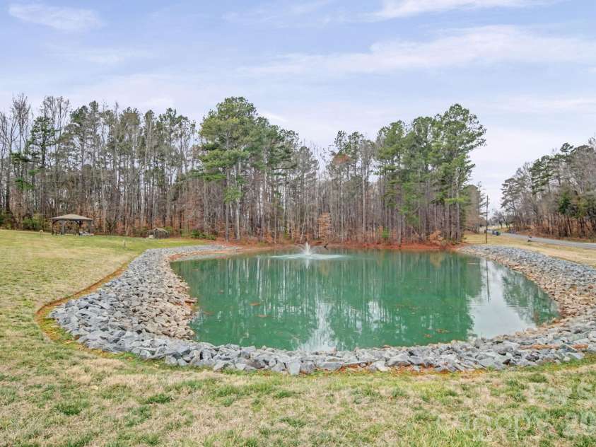1296 Ben Black Road, Midland, NC 28107.  MLS# CAR4349291, YatesRealty ID 8300. Stocked Pond with fountain