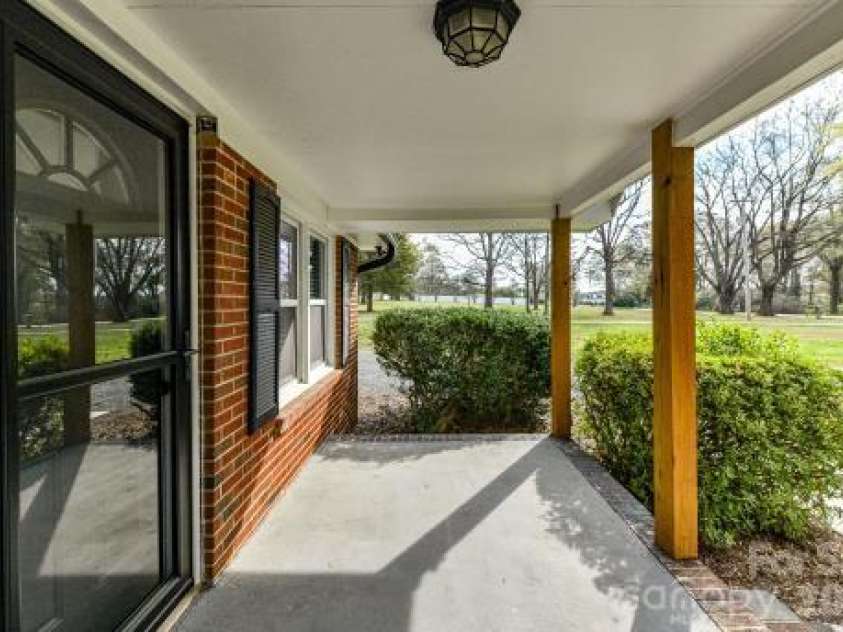 7714 Old Waxhaw Monroe Road, Waxhaw, NC 28173.  MLS# CAR4355316, YatesRealty ID 8306. Front porch