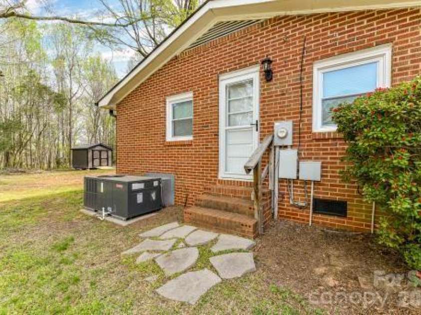 7714 Old Waxhaw Monroe Road, Waxhaw, NC 28173.  MLS# CAR4355316, YatesRealty ID 8306. Side view