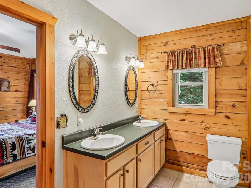1064 Point Of View Drive, Waynesville, NC 28785.  MLS# CAR4404544, YatesRealty ID 831. En suite bathroom