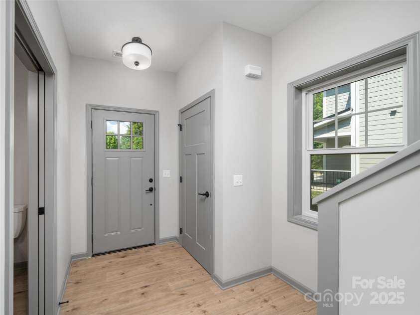 100 Red Twig Lane, Burnsville, NC 28714.  MLS# CAR4155743, YatesRealty ID 8313. Foyer off garage internal Entrance and coar closet