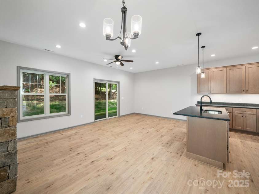 100 Red Twig Lane, Burnsville, NC 28714.  MLS# CAR4155743, YatesRealty ID 8313. Windows  and sliding glass doors to covered back porch 