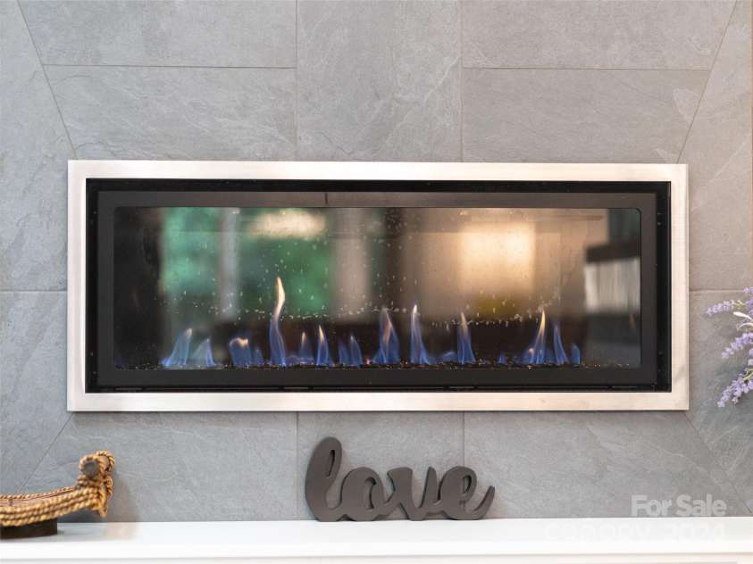 211 Cheyenne Court, Asheville, NC 28803.  MLS# CAR4160784, YatesRealty ID 8314. Beautiful gas fireplace.